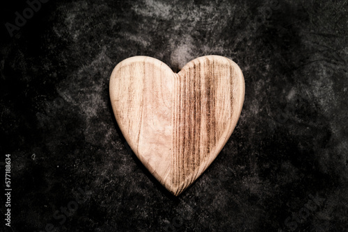 wooden heart on concrete floor