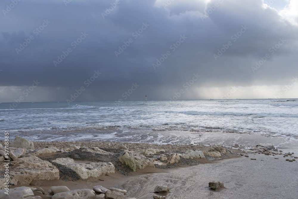 pebble beach near the ocean at Rivedoux, Re island, France. pebble beach near the ocean at Rivedoux, Re island, France.