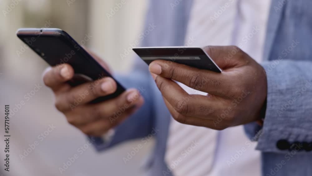 Black man, hands and phone with credit card in ecommerce, online shopping or banking in city. Hand of African American businessman typing on smartphone for internet purchase, bank app or transaction Black man, hands and phone with credit card in ecommerce, online shopping or banking in city. Hand of African American businessman typing on smartphone for internet purchase, bank app or transaction