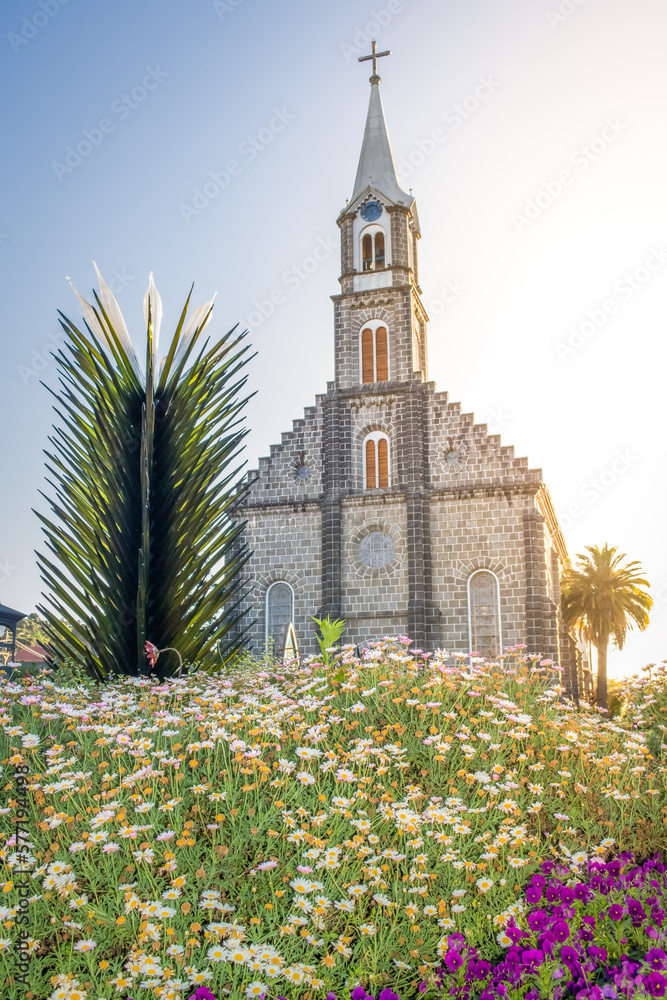 Stone Church with colorful flowerbed, Gramado village, Southern Brazil