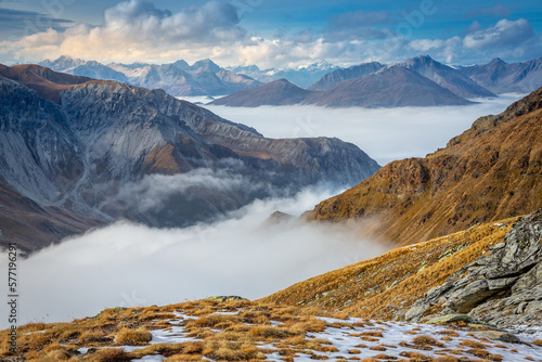 Obraz na płótnie Stelvio pass, mountain dramatic landscape at dawn above mist, Italy w salonie