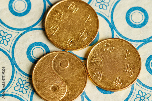 I ching ancient Chinese oracle, Book of Changes or Classic of Changes, with old coins