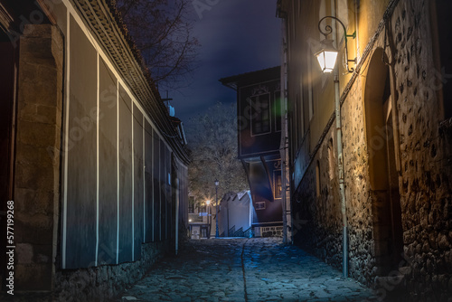 Dark and mysterious alley illuminated at night in Plovdiv, Bulgaria