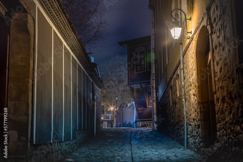 Obraz na płótnie Dark and mysterious alley illuminated at night in Plovdiv, Bulgaria w salonie