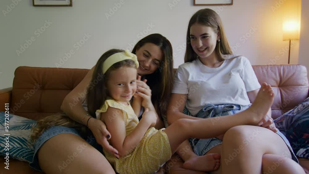 Close-up view of lovely family relaxing in their cozy home. Portrait of beautiful women of different age looking positive and joyous indoors. High quality 4k footage Close-up view of lovely family relaxing in their cozy home. Portrait of beautiful women of different age looking positive and joyous indoors. High quality 4k footage