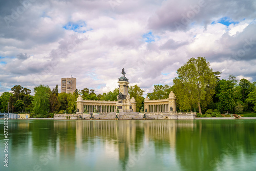 Monument to King Alfonso XII in the pond of the Retiro park in the city of Madrid  during a sunny spring day with blue sky