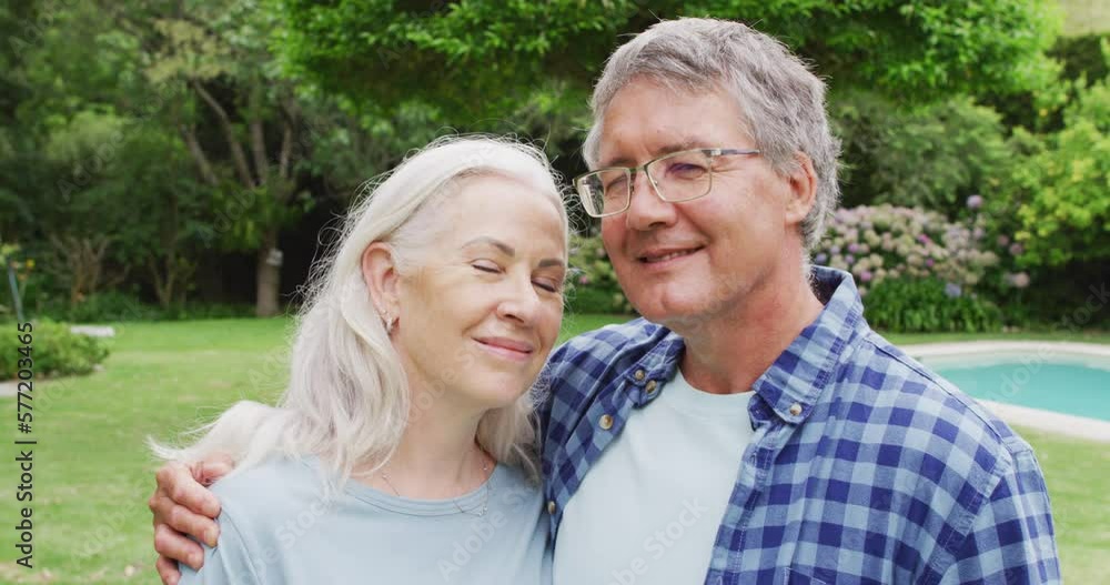 Animation of caucasian senior couple embracing in garden Animation of caucasian senior couple embracing in garden
