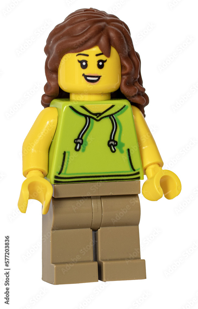 Lego figurine of a girl with long hair wearing a hoody. Stock