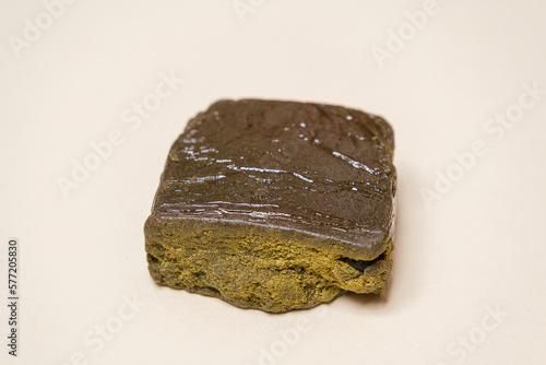 Super dry hash, medical marijuana extraction high quality fresh hashish cannabis pollen with oil on white background.
