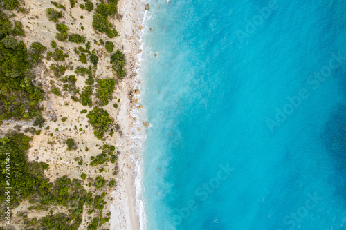 Straight down view on waves on rocky shore by Bunec Beach area in Summer 2022, Albania © marketanovakova