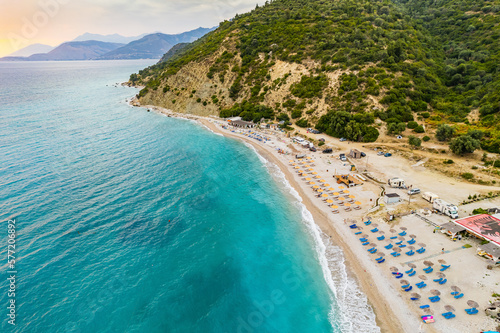 Aerial view of Bunec Beach area with beach umbrellas in Summer 2022, Albania