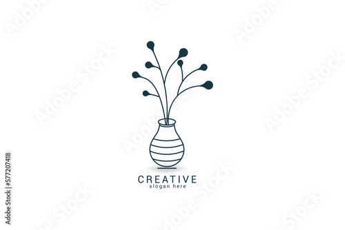 logo on which an abstract image of an elegant vase with flowers.