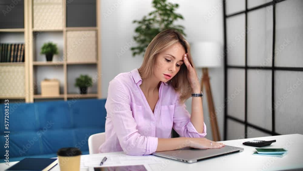 Tired woman finished routine work suffering migraine headache anxiety stress at laptop workplace Tired woman finished routine work suffering migraine headache anxiety stress at laptop workplace