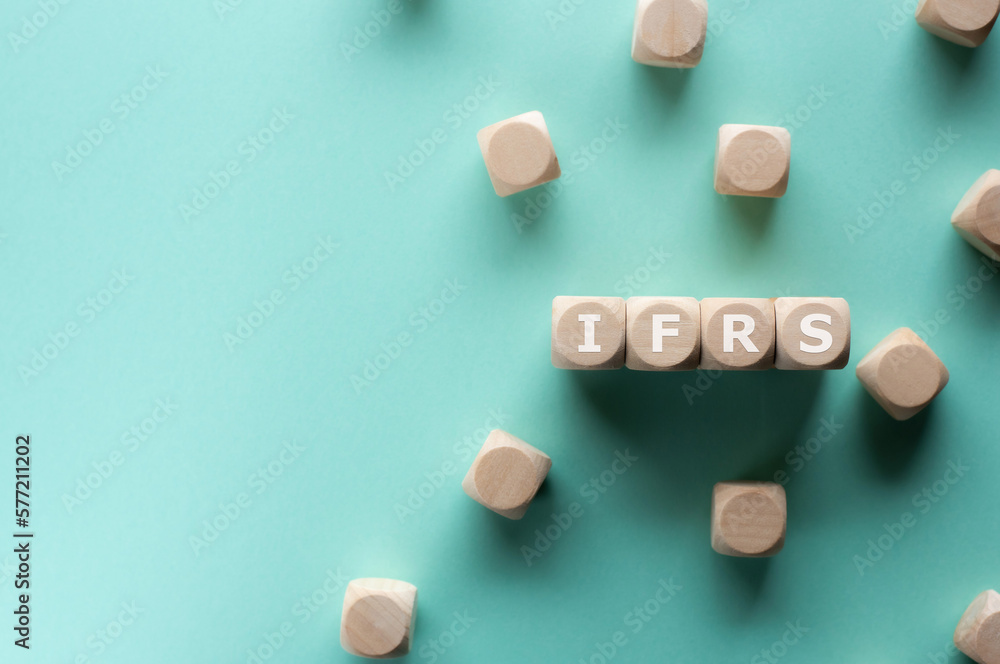 There is wood cubes with the word IFRS. It is an acronym for International Financial Reporting Standard an eye-catching image. There is wood cubes with the word IFRS. It is an acronym for International Financial Reporting Standard an eye-catching image.