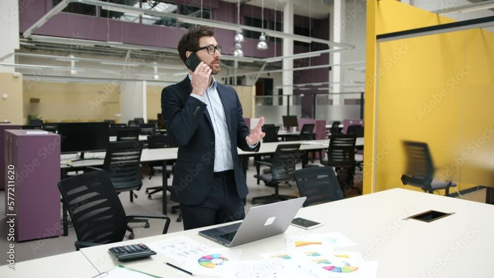 Portrait of caucasian man in glasses and formal suit having a business call. Close-up view of adult professional chatting with a partner. High quality 4k footage Portrait of caucasian man in glasses and formal suit having a business call. Close-up view of adult professional chatting with a partner. High quality 4k footage