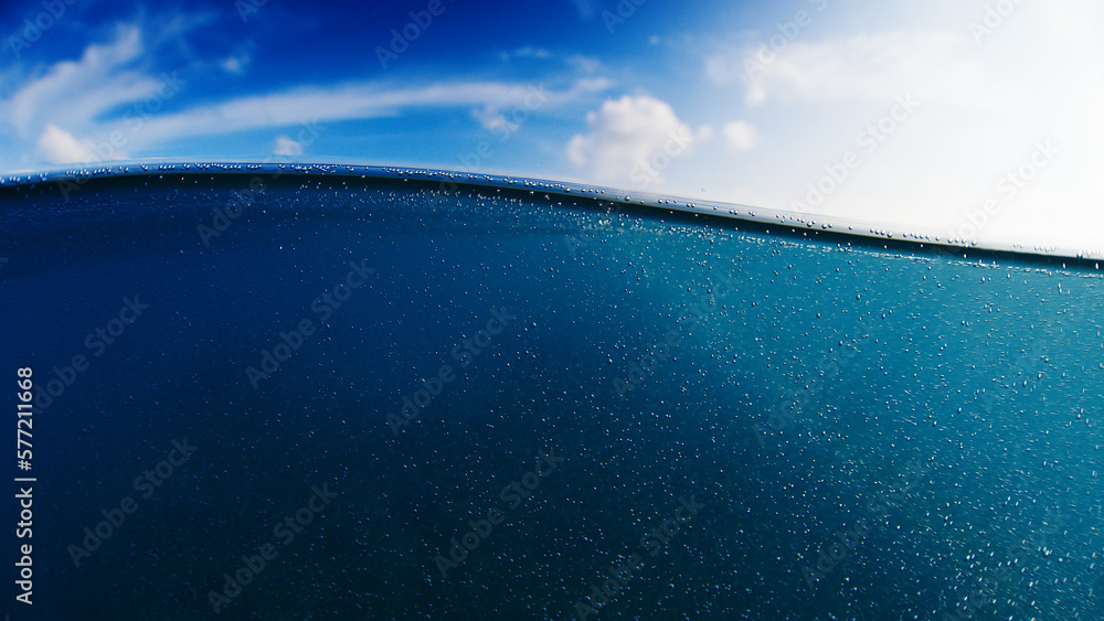 Calm sea splitted view with gentle wave, above and underwater view of the sea