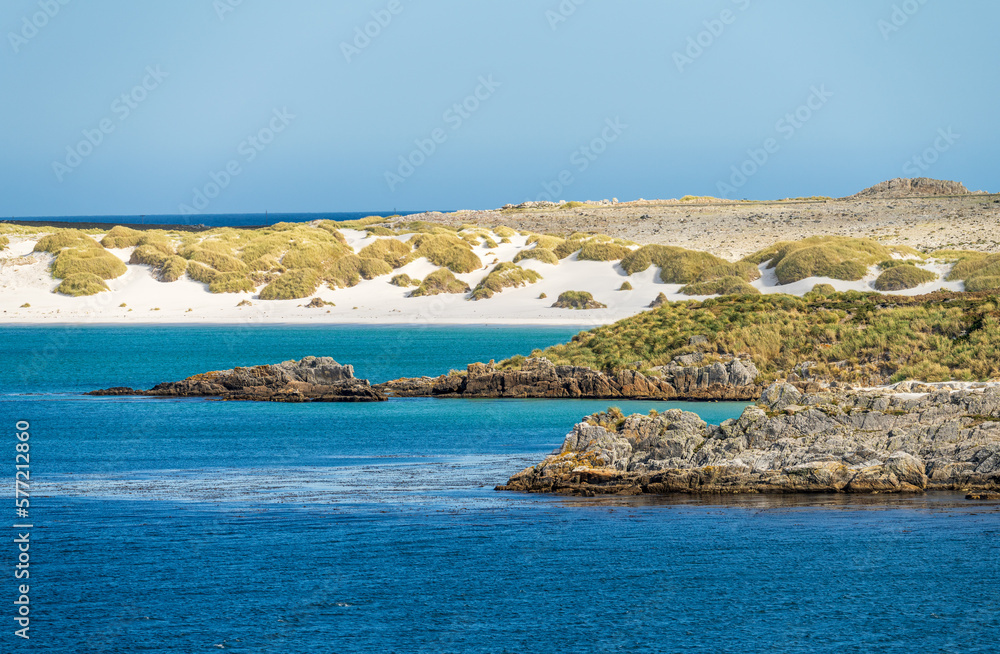 Sandy beaches and rocks when approaching the port of Stanley on the Falkland Islands from the ocean