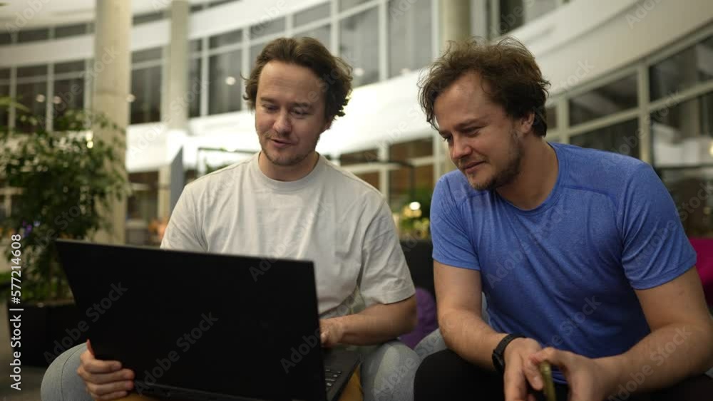 twin brothers study work together using a neural network, the brothers work with a neural network, program, work with a 3D model on a graphics tablet twin brothers study work together using a neural network, the brothers work with a neural network, program, work with a 3D model on a graphics tablet