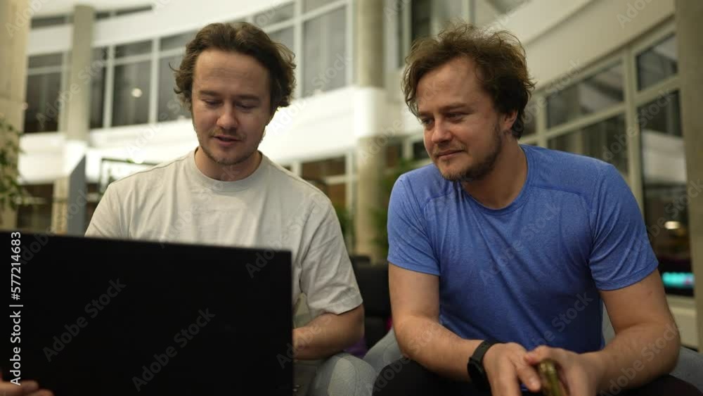 twin brothers study work together using a neural network, the brothers work with a neural network, program, work with a 3D model on a graphics tablet twin brothers study work together using a neural network, the brothers work with a neural network, program, work with a 3D model on a graphics tablet