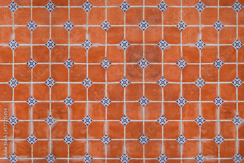 traditional mexican red wall with adornments of handmade hand painted talavera poblana tiles in Atlixco, Puebla, Mexico