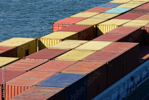 Bild auf Leinwand many colorful containers on a river freighter on the rhine on a sunny day