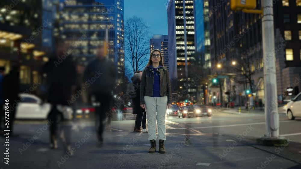 Time-lapse of woman standing still on crowded evening street Time-lapse of woman standing still on crowded evening street