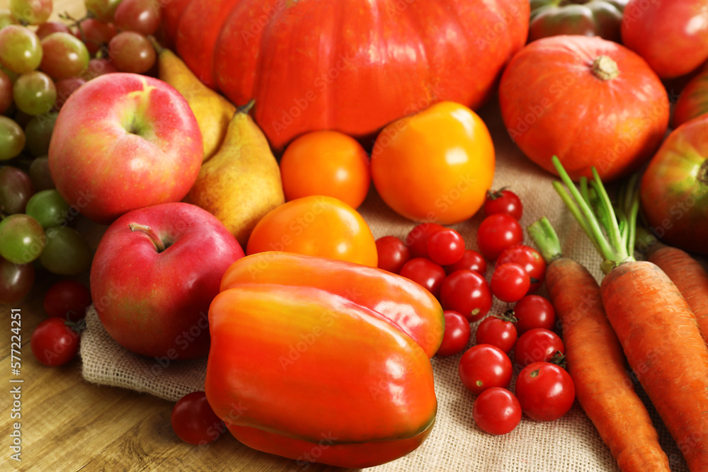 Different fresh ripe vegetables and fruits on wooden table, closeup Different fresh ripe vegetables and fruits on wooden table, closeup