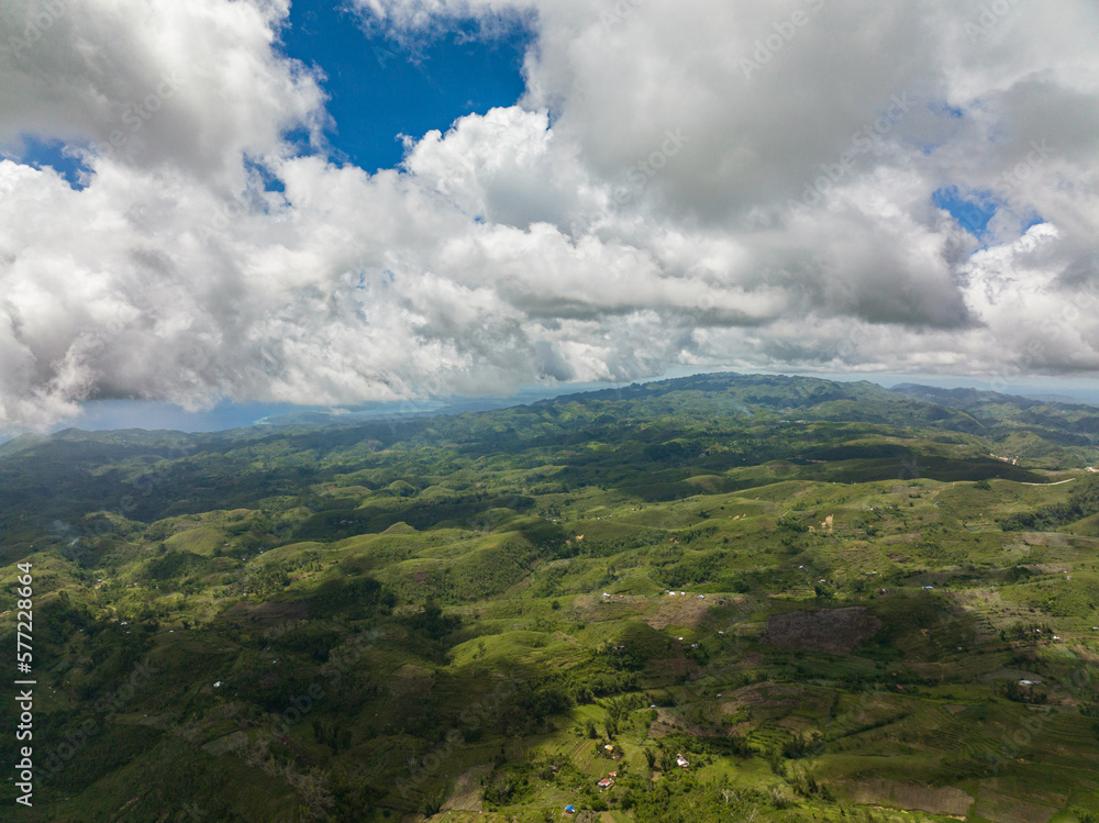 Aerial view of countryside with agricultural land in the mountains. Libo hills. Cebu island, Philippines.