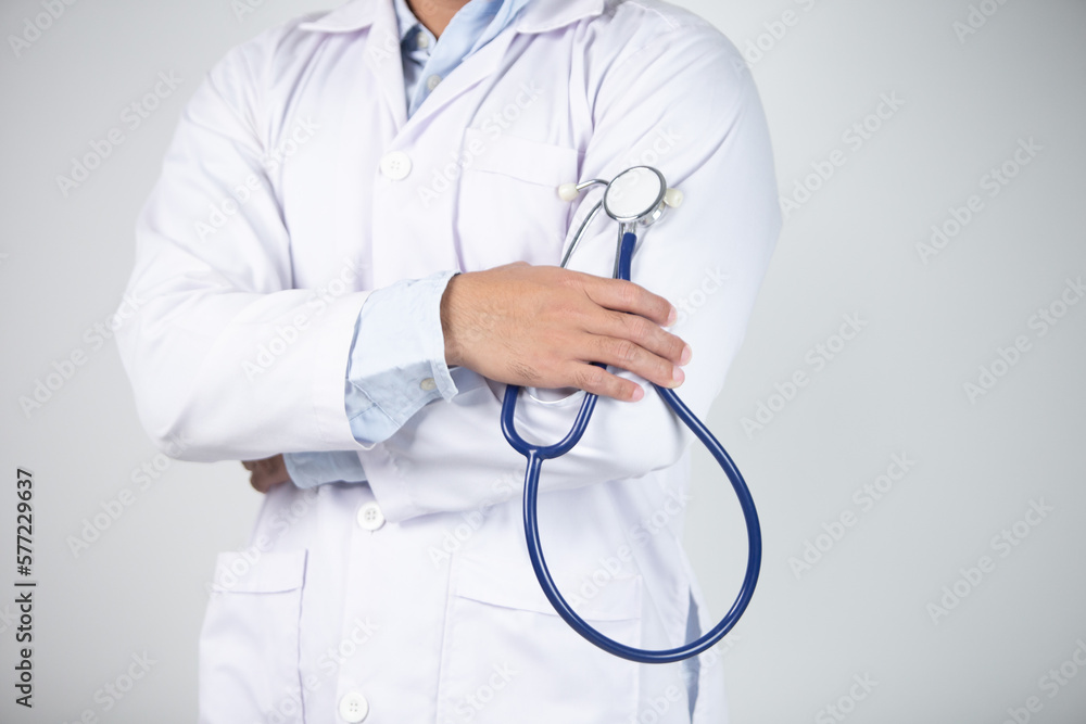 male doctor is holding stethoscope into the camera male doctor is holding stethoscope into the camera