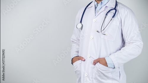 male doctor is holding stethoscope into the camera