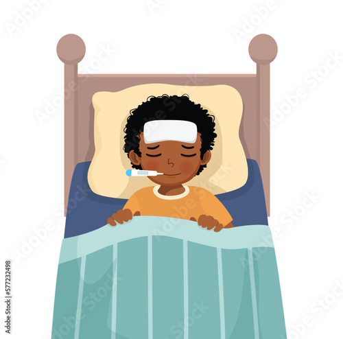 Sick little African boy has high fever flu and cold lying on bed with thermometer in his mouth