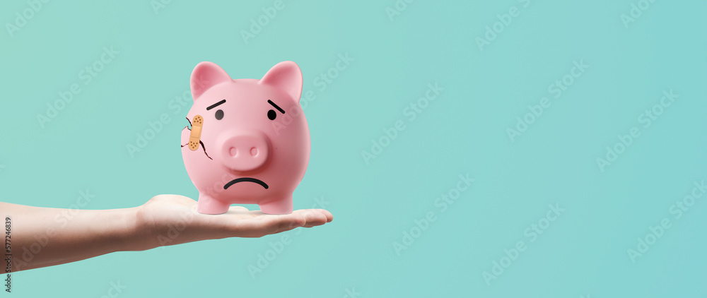 sad and broken pink piggy bank with a blessed one - concept of failure in saving and bad finances - obrazy, fototapety, plakaty 