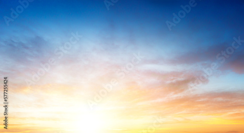 Sunset sky in the Morning with colorful orange sunrise on blue white clouds sky Background © paul