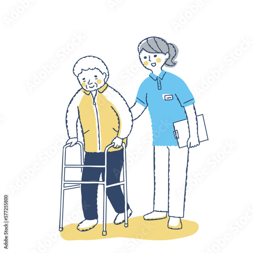 歩行器を使って歩くシニア女性と介助する女性