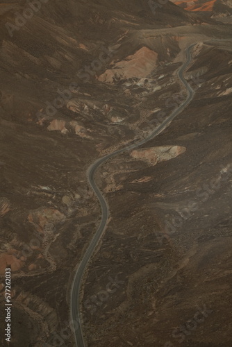 road through the desert hills aerial view