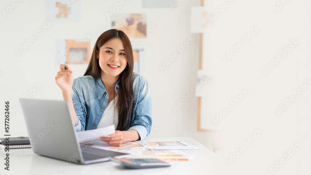 Banner with blank copyspace, Design building concept, Female architect holding blueprint of house plan and smiling on camera Banner with blank copyspace, Design building concept, Female architect holding blueprint of house plan and smiling on camera