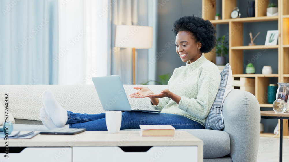 Happy black woman waving while using a laptop to make a video call in the living room. Young african american female excited to have a casual chat with friends or family at home during lockdown Happy black woman waving while using a laptop to make a video call in the living room. Young african american female excited to have a casual chat with friends or family at home during lockdown