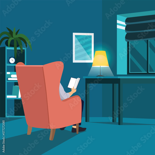 Man reading book in the dark. Male character sitting in the armchair under the lamp and holding book back view angle