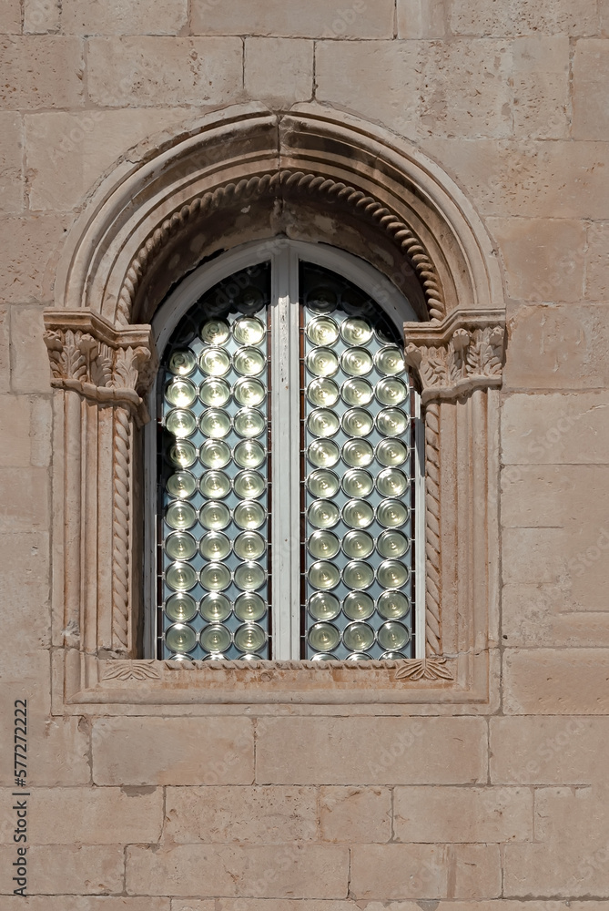 Ornate window on ancient building in Dubrovnik, Croatia