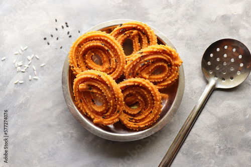 Butter murukku. also known as benne murukku or venna chakli. Chakli is a savory deep fried crispy snack made with rice and gram flour along with black sesame and spices. Copy space. photo