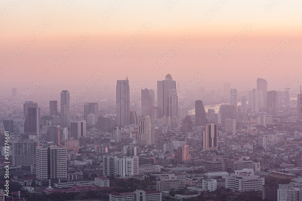 Bad air pollution in City. PM 2.5 dust in Bangkok or center city, Capital city are covered by heavy smog, Misty morning and sunrise in downtown with bad air pollution, Place to risk of cancer,Thailand