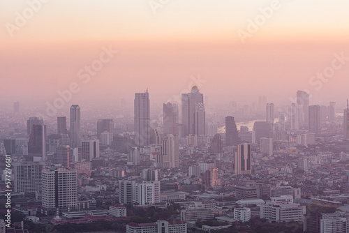 Bad air pollution in City. PM 2.5 dust in Bangkok or center city  Capital city are covered by heavy smog  Misty morning and sunrise in downtown with bad air pollution  Place to risk of cancer Thailand