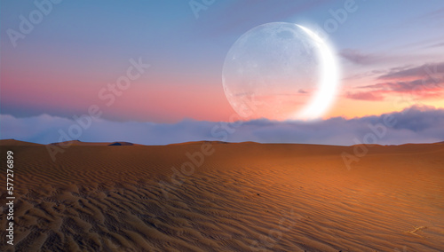 Beautiful sand dunes in orange desert at sunrise with crescent moon - Sahara  Morocco 