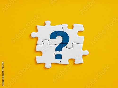 Problem solving, brainstorming and team effort for creative solutions in business. FAQ. Question mark icon on connected jigsaw puzzle pieces.