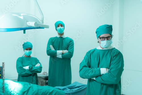 Portrait of professor of medicine in cardiology and a team of doctors in the operating room undergoing heart transplant surgery