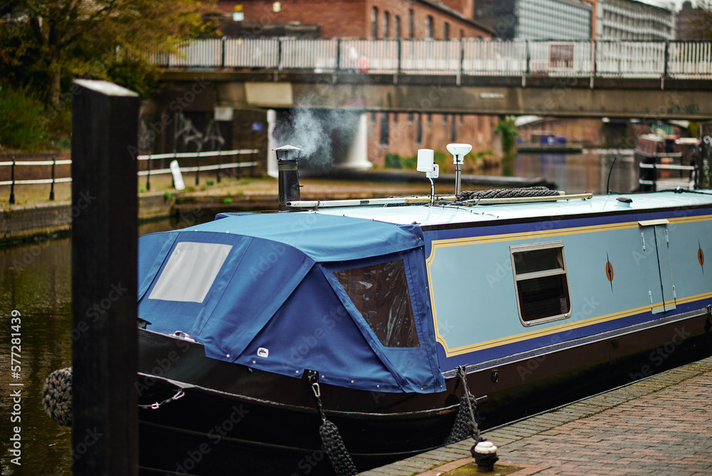Colorful boats, houses on the water in the canals of Birmingham
