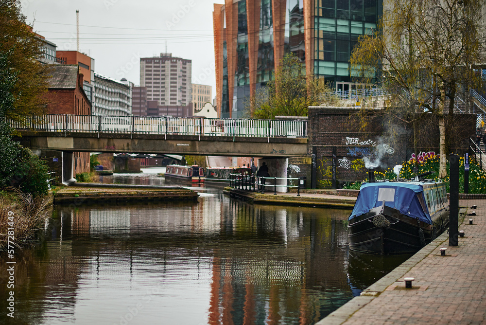 Colorful boats, houses on the water in the canals of Birmingham