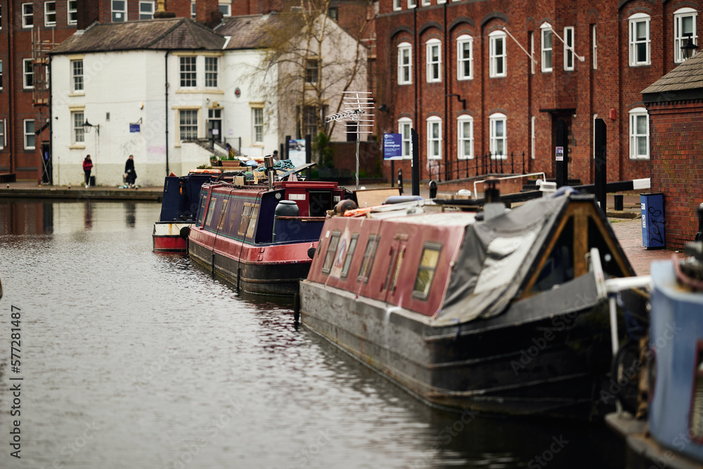 Colorful boats, houses on the water in the canals of Birmingham