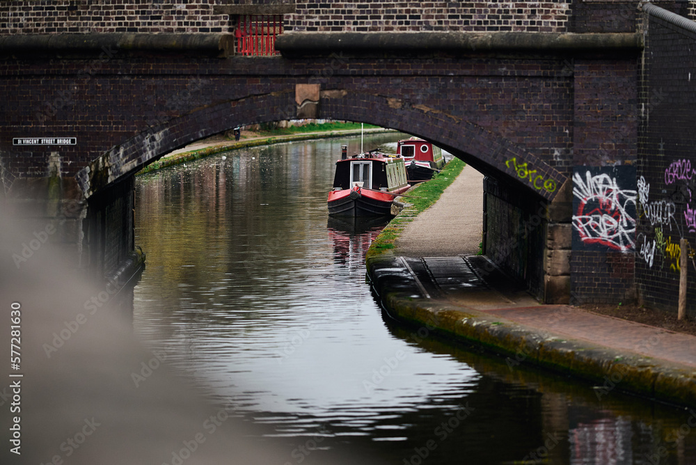 Orange house boat, Birmingham canals, housing estate