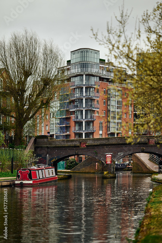 Colorful boats, houses on the water in the canals of Birmingham